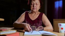 Grandmother reading a book Stock Footage