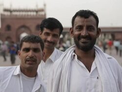 MH Three Men Smiling in Font of Jama Masjid Mosque / India Stock Footage