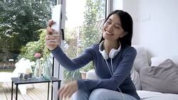 Beautiful woman taking selfies with her smartphone Stock Footage