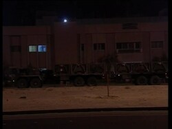 GWT: Military convoy, hardware on the move at night News Clip