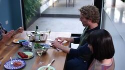 Friends scoialise at a Dinner Party in house Stock Footage