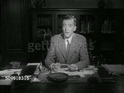 1952: CARNEGIE MUSEUM: Angled WS Carnegie Museum w/ people walking steps. WS Exhibition sign '1952 Pittsburgh International of Current Paintings' MS Director Gordon B. Washburn (1904-1983) sitting at desk SOT saying show as about 'youth', now, future Instructional Video