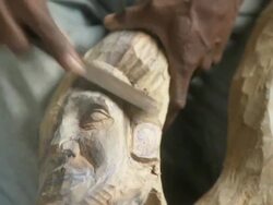 CU Man filing wood sculpture / Havana, Cuba Stock Footage