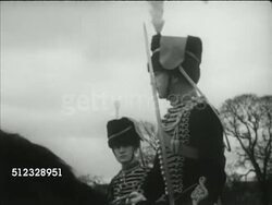 1953: PREPARING TROOPS FOR CORONATION: VS Soldiers acclimatizing British Army horses to loud parade sounds, soldiers banging metal pots & gas canisters. VS The King's Troop Royal Horse Artillery (RHA) practicing walking route, TD MS Horse's hooves. Instructional Video