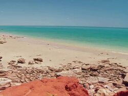 WS PAN View of Gantheaume point and red sandstone cliffs at beach / Broome, Western Australia, Australia Stock Footage