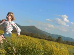 HD Super Slow-Mo: Little Girl Running In The Meadow Stock Footage