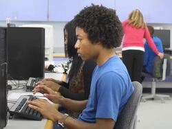 Male Student Works on Computer in Classroom Stock Footage