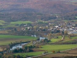 WS ARIEAL View of Wooded area with autumn color and lake / Vermont, United States Stock Footage