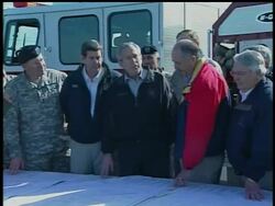 President Bush gets a briefing from FEMA in Enterprise, Alabama.  He toured the tornado damage from Thursday, and meet with the families of the eight high school students who died. News Clip