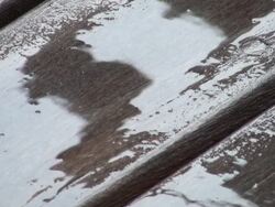 End of the downpour; drops on teak deck floor Stock Footage