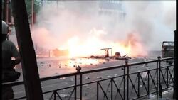 Protesters set fires in central Athens, night shots News Clip