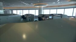 Men work at computer terminals in a control room. Stock Footage