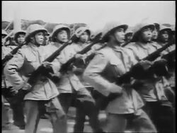 B/W 1950s PAN rows of soldiers carrying guns marching in parade / North Vietnam / newsreel Stock Footage