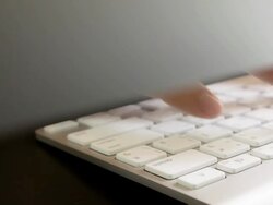 Businessman typing on a computer keyboard Stock Footage