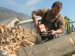 HD SLOW-MOTION: Lumberjack using chainsaw Stock Footage