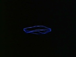 Sparks - MCU lines of blue sparks between unseen points against black background Stock Footage