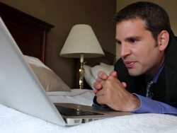 CU Man sleeping on bed talking to family on laptop / Portland, ME, United States Stock Footage