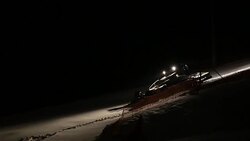 Machine for leveling the ski slopes works at night. Stock Footage