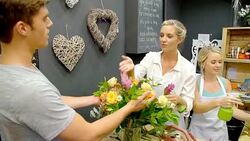 Florists arranging bouquet in flower shop Stock Footage