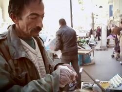 CU Shot of City and street and street vendor making sandwich / Amman, Jordan Stock Footage
