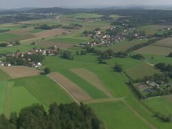 WS AERIAL View of farm field, houses and road way with moving vehicles / Germany Stock Footage
