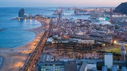 Elevated dusk view over Barcelona  beaches and seaport, Barcelona, Catalunya, Spain - Time lapse Stock Footage