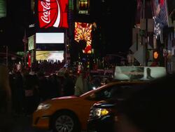 Slow motion medium shot of bustling Times Square at night / New York City, New York, United States Stock Footage