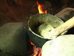 Afar woman cooking pastry Stock Footage