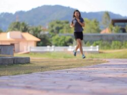 Woman jogging in park Stock Footage