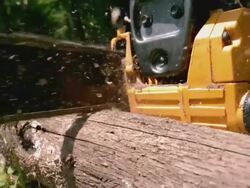 CU SLO MO Shot of Man hand holding chain saw cutting log / Morristown, New Jersey, United States Stock Footage