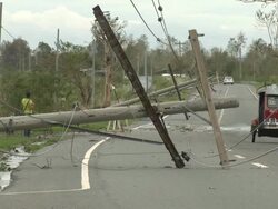 Downed power lines lie on road after typhoon Megi or Juan hit the Philippines. Super Typhoon Megi or Juan, NE Luzon, Philippines Oct 2010 / AUDIO Stock Footage