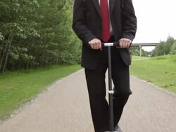 Business man rides a scooter to work Stock Footage