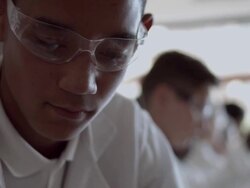 CU School boys in science class with beacons and test tubes Stock Footage