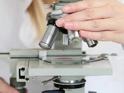 Female scientist with microscope Stock Footage