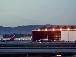 WS T/L Aircraft hangars and runways at dusk, LAX airport / Los Angeles, California, USA Stock Footage