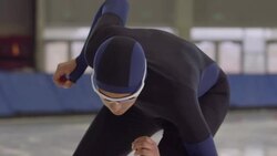CU SLO MO Long track speed skater in starting position before race on ice in arena Stock Footage