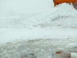Snowblower Clearing Snow off Driveway Stock Footage