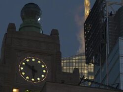 A midtown high rise clock tower close to Time Square.  The globe on top of the building blinks Stock Footage