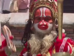 MS Man dressed up in  elaborate monkey costume and  performing dance with bells AUDIO / Kathmandu, Central Region, Nepal Stock Footage