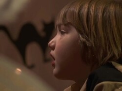 HD DOLLY: Little Boy Watching Theatrical Performance Stock Footage