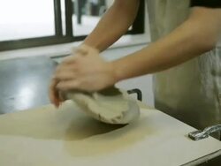 MS Shot of female potter kneads clay in studio / Kyoto, Japan Stock Footage