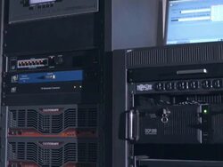 CU PAN across rack mounted servers and digital sound processors driving digital cinema projectors in movie theater installation Stock Footage
