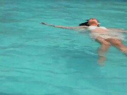 Young woman swimming in the farm house, Delhi, India Stock Footage