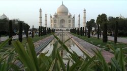 A pool in the charbagh reflects the Taj Mahal in Agra, India. Stock Footage