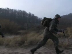 soldiers running on the beach steadycam shot Stock Footage