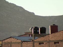 Roofs with mountain in b/g, Cochabamba, Bolivia Stock Footage