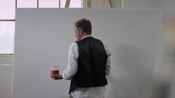 Artist starts painting on canvas Stock Footage