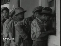 1935: MEXICO INDUSTRIAL: WS Factory mill. VS Mexican factory workers at pay, cash window. EXT MS Group of workers walking. MS President Lazaro Cardenas w/ crowd, shaking man's hand, entering car. Instructional Video