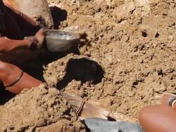 CU Ovahimba Women Watering The Soil Stock Footage