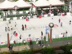 A group of people ice skating outside in Union Square during the holidays. Stock Footage